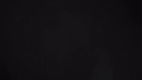 White Dust Particles Flying On Black Background. Slow motion. Stock Footage 74685928