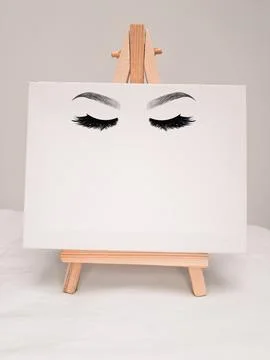 White easel with eyelash Extensions copy space Stock Photos