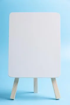White easel front blue background Stock Photos