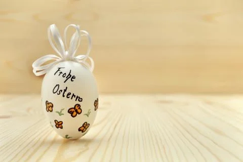 White Easter egg lying on tree. Stock Photos