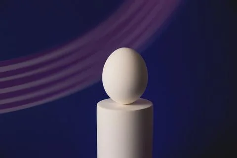 White easter egg on podium in neon and purple light Stock Photos
