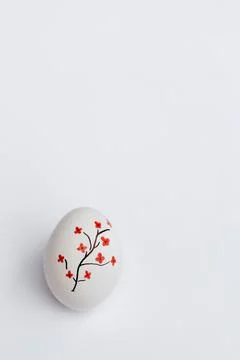 White Easter egg with red flowers Stock Photos