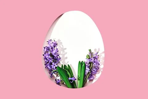 White easter Egg shaped hole with copy space on pink background. Beautiful 写真素材