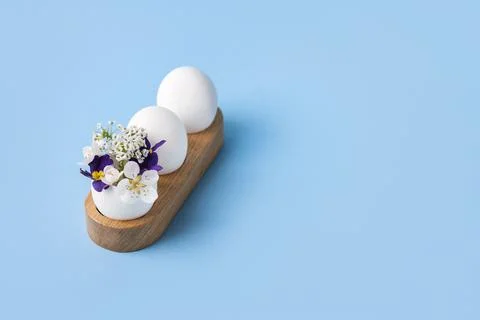White easter egg with spring flowers Stock Photos