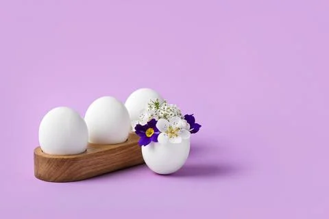 White easter egg with spring flowers Stock Photos