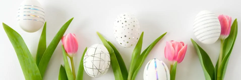 White easter eggs with silver pattern and pink flowers Stock Photos