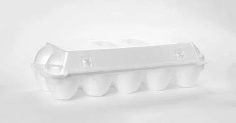 White egg container. Close up. Isolated on white background Fotos Stock