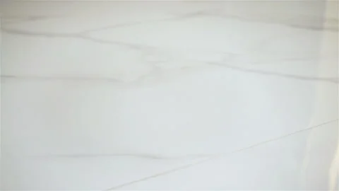 White Egg falls and Breaks on the Floor. Slow Motion Video Clip Stock Footage 128921417