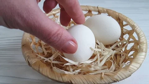 White egg hand takes Stock Footage 87879958
