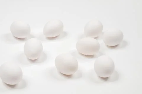 White egg. Raw eggs on white background. Concept happy easter. Фото