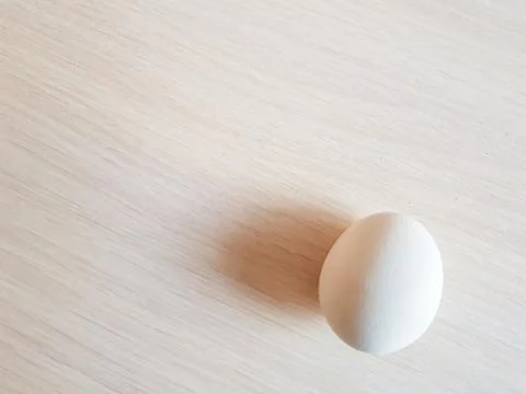 White egg on a table Stock Photos