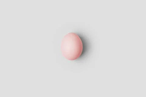 White egg on the white background in center. Design, visual art, minimalism Stock Photos