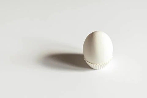 White egg on a white isolated background with shadow. Ingredient.Healthy food Stock Photos