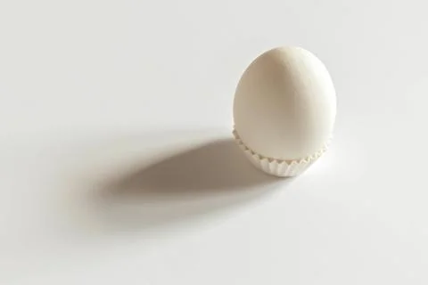 White egg on a white isolated background with shadow. Ingredient.Healthy food Stock Photos