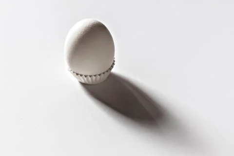 White egg on a white isolated background with shadow. Ingredient.Healthy food Stock Photos
