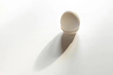 White egg on a white isolated background with shadow. Ingredient.Healthy food Stock Photos