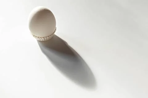 White egg on a white isolated background with shadow. Ingredient.Healthy food Stock Photos