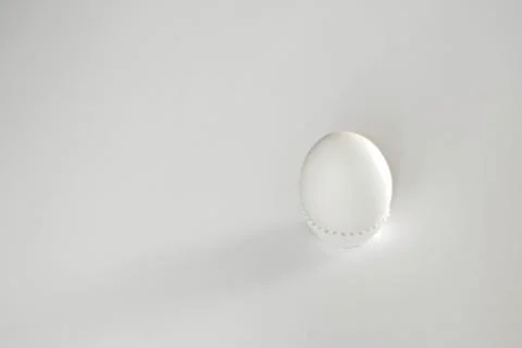 White egg on a white isolated background with shadow. Ingredient.Healthy food Stock Photos