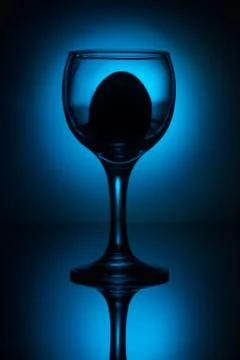 White egg in wine glass Stock Photos
