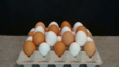 White eggs and brown eggs. Stop motion animation Video stock 78990648