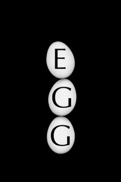 White eggs on a black background Stock Photos