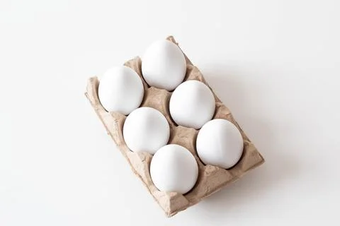 White eggs in case Stock Photos