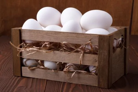 White eggs in a crate Stock Photos