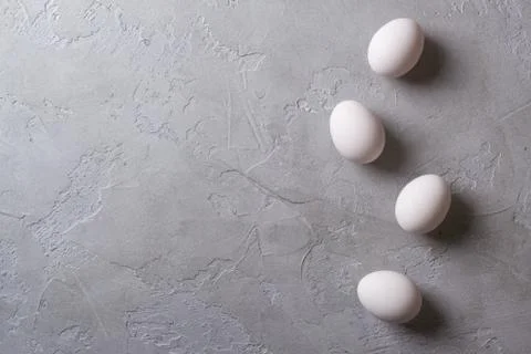 White eggs on a gray concrete table. Easter photo concept. Copyspace Stock Photos