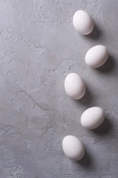 White eggs on a gray concrete table. Easter photo concept. Copyspace Stock Photos
