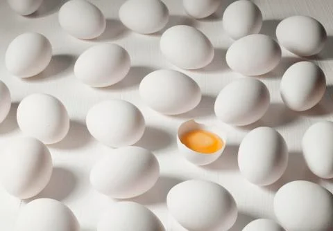 White eggs, one broken open Stock Photos