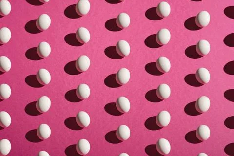 White eggs pattern on pink purple colors background, happy Easter day Stock Photos