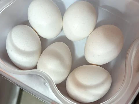 White Eggs in a Plastic Container Stock Photos