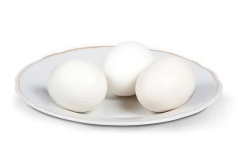 White eggs on a plate Stock Photos