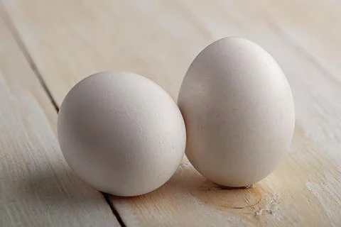 White eggs on a white table Stock Photos