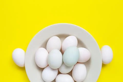 White eggs on yellow background. Foto stock
