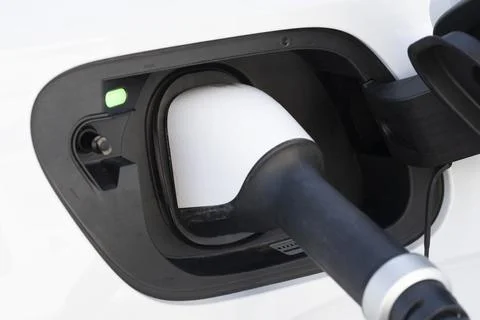 White electric car charging Stock Photos