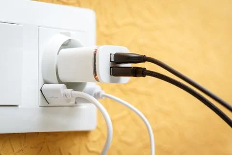 White electric plug with built in usb ports and usb charger with multiple b.. Stock Photos