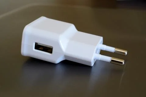 White electric plug with USB socket closeup. Stock Photos