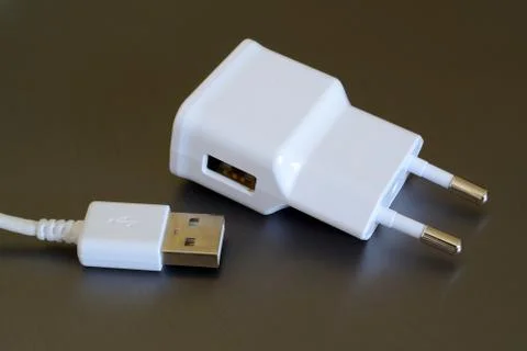 White electric plug with USB socket and USB plug. Stock-Fotos