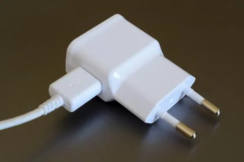 White electric plug with USB socket and USB plug. Stock-Fotos