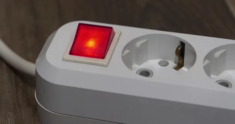 White electric portable socket with red power and on indicator, close-up shot Stock Footage 318251136