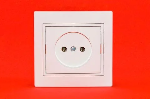 White electric socket isolated on red background Stock Photos