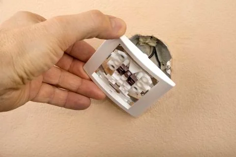 White electric switch with on a wall and without cover Stock Photos