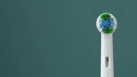 White electric toothbrush on a blue background. Zoom effect. Stock Footage 282013016