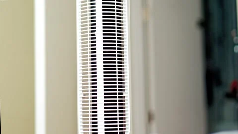 White electric tower fan close up for cooling indoor summer heat Stock Footage 335602548