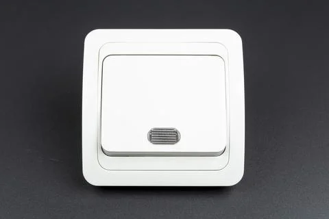 White electrical light switch on black background Stock Photos