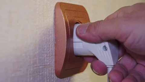 White electrical plug is inserted into the socket Stock Footage 103123396