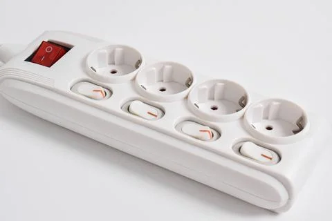 White Electrical plug in outlet socket at home isolated on white background Stock Photos