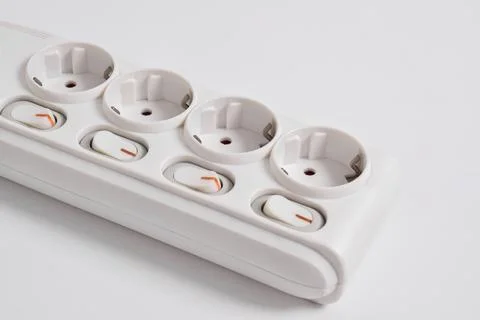 White Electrical plug in outlet socket at home isolated on white background Stock Photos