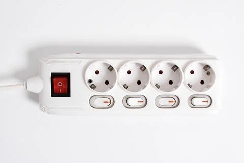 White Electrical plug in outlet socket at home isolated on white background Stock Photos